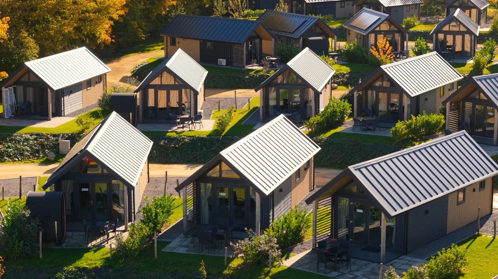 Landscaped holiday park with wooden chalets