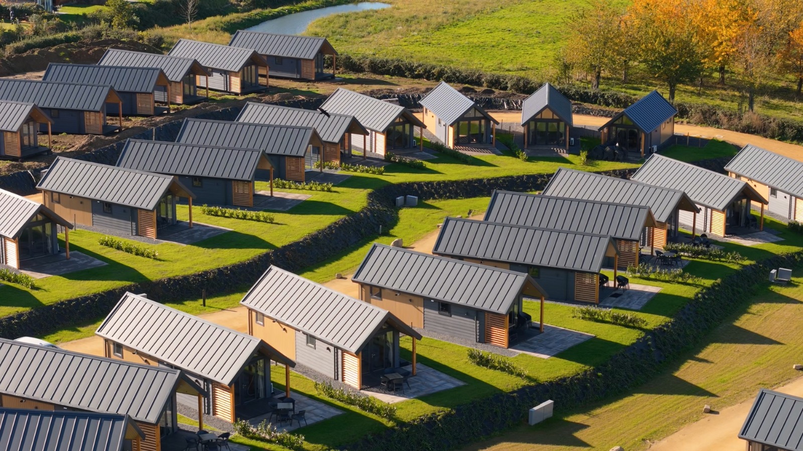 Full view of a holiday park with modern wooden chalets